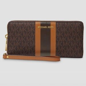 Michael Kors Jet Set Travel Continental Brown.
8.25" W x 4" H x 1" D